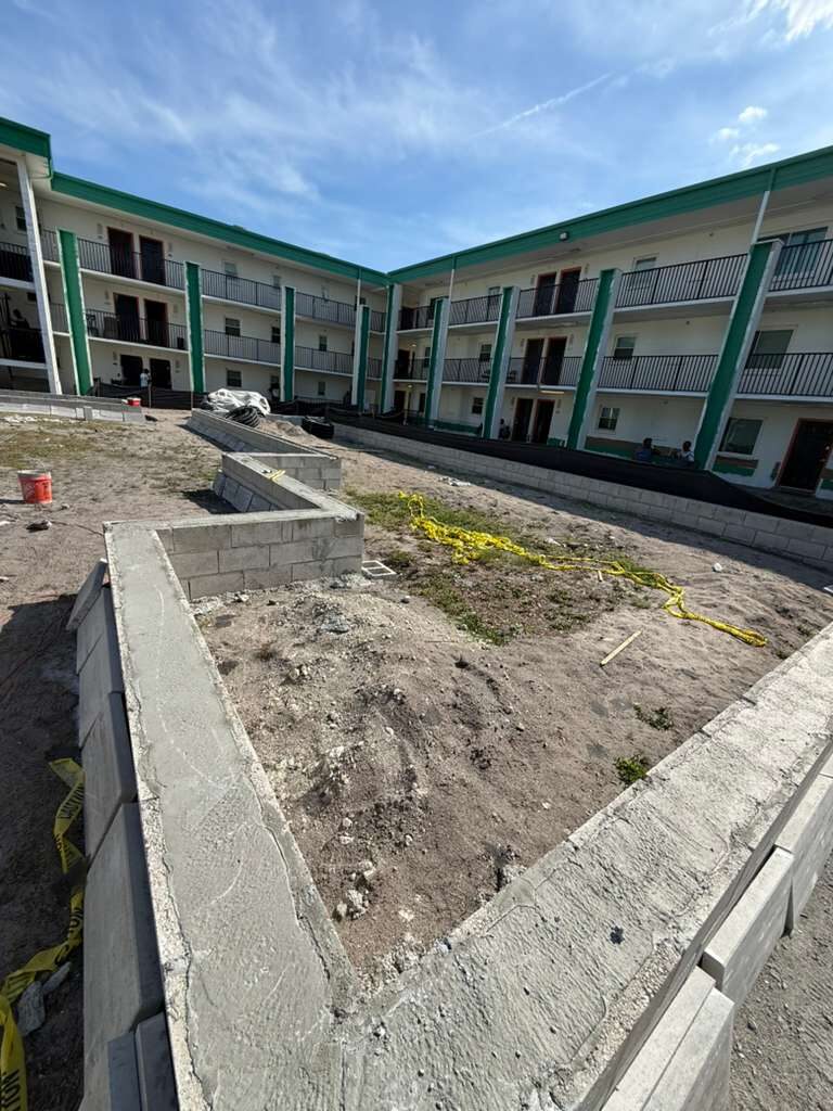 Overview of exterior construction with newly laid concrete block structures and buildings